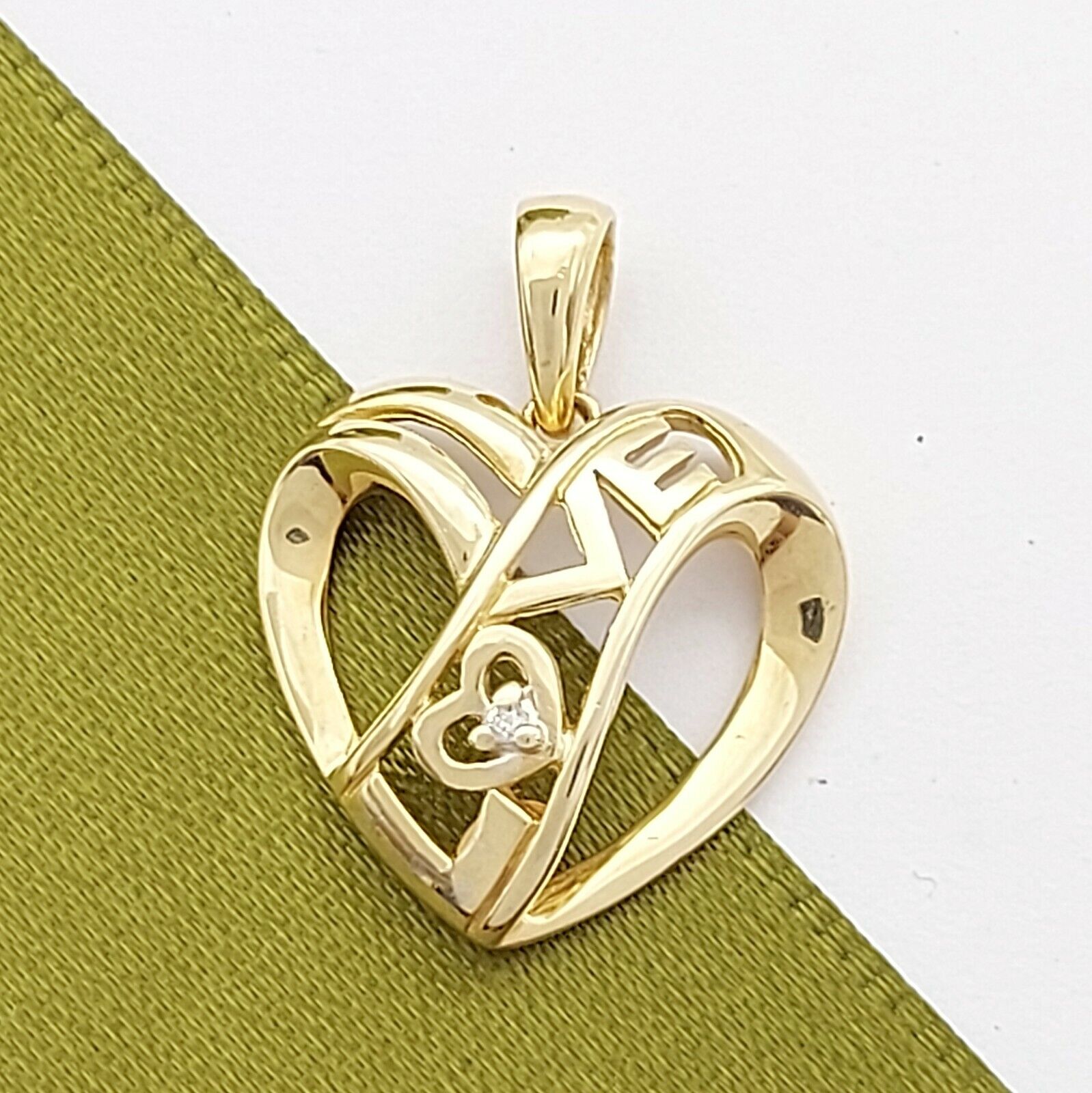 Ladies Pendant 9ct (375, 9K) Yellow Gold Open Heart 'Love' Diamond Chip Pendant