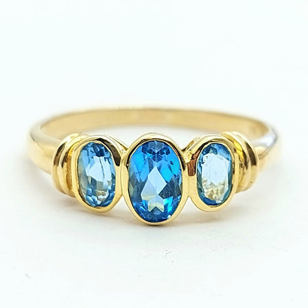 Ladies Yellow Gold 9ct (375,9k) Trilogy Blue Oval Topaz Ring